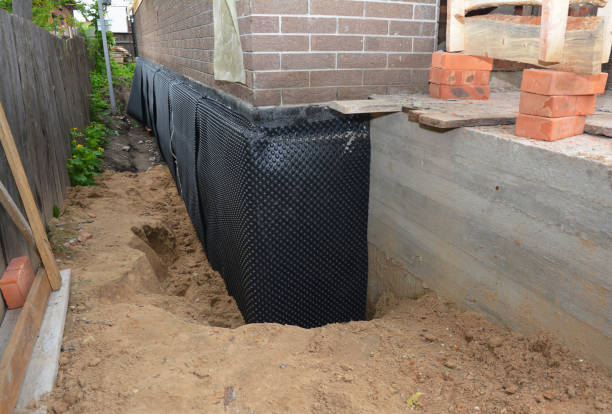 Happy homeowners after waterproofing job in Gregory